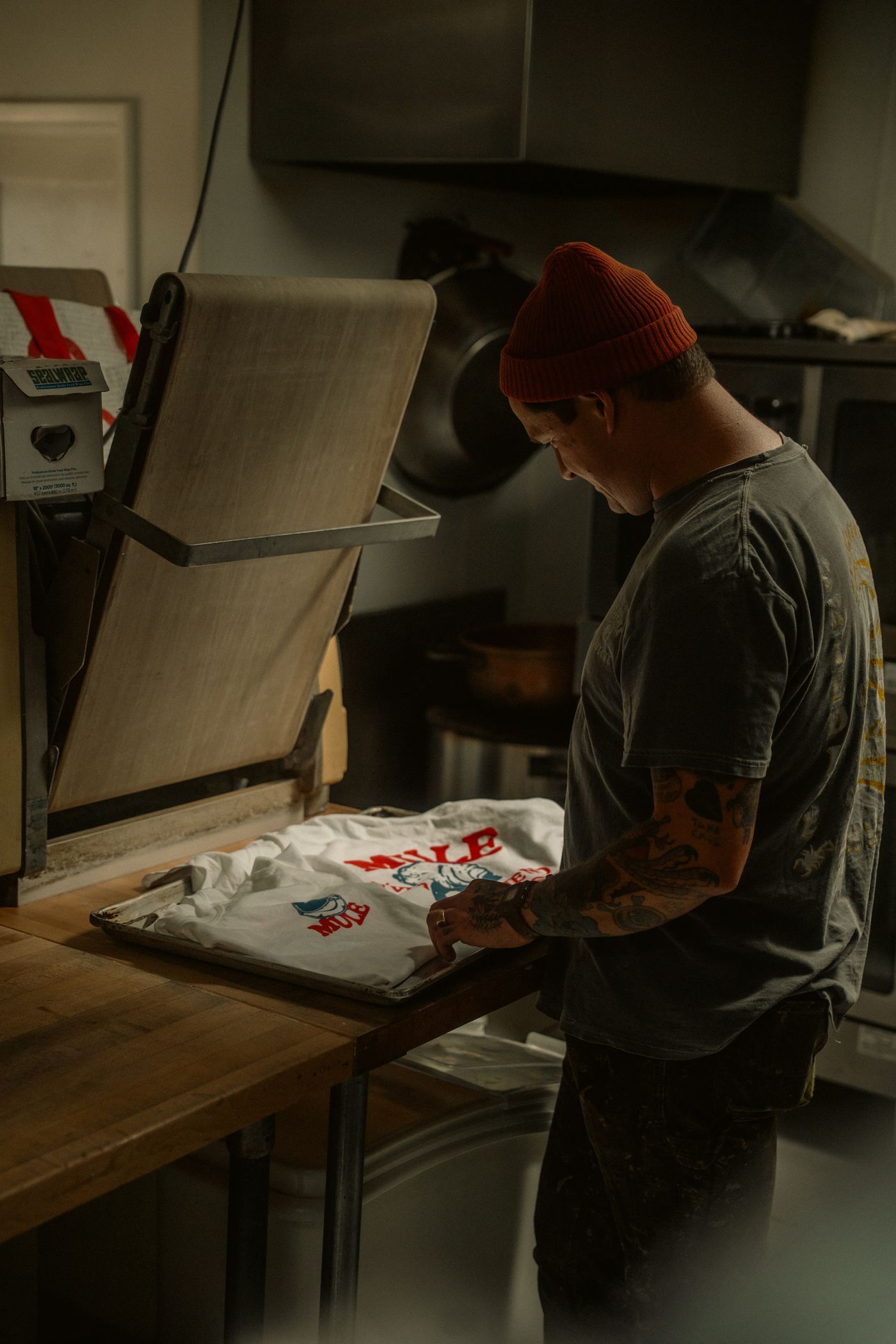 The heat press doesn't forgive: whatever is in the file — background included — ends up on the shirt