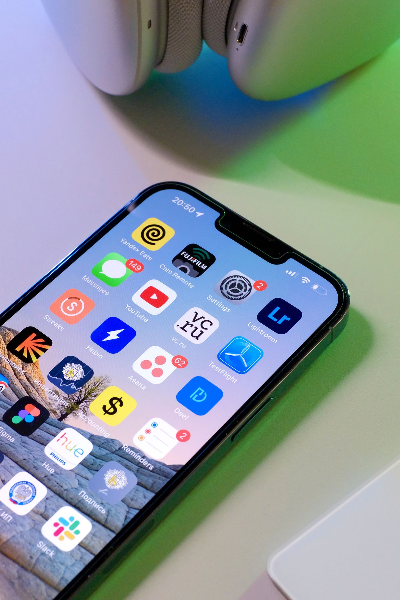 Close-up of an iPhone home screen filled with app icons arranged in a grid, every icon showing a solid opaque background behind its symbol