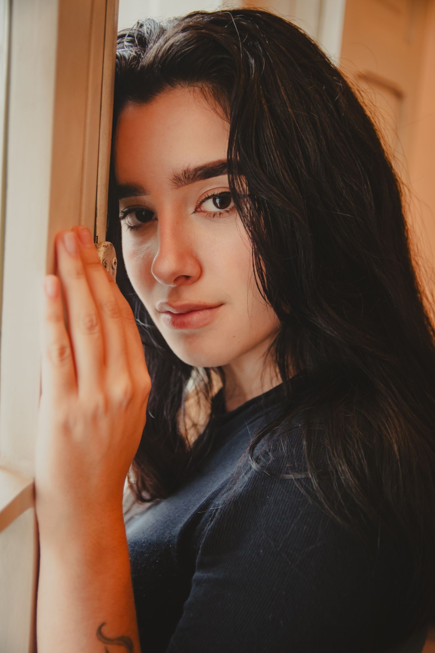 Soft window light is the most flattering — and cheapest — portrait lighting there is