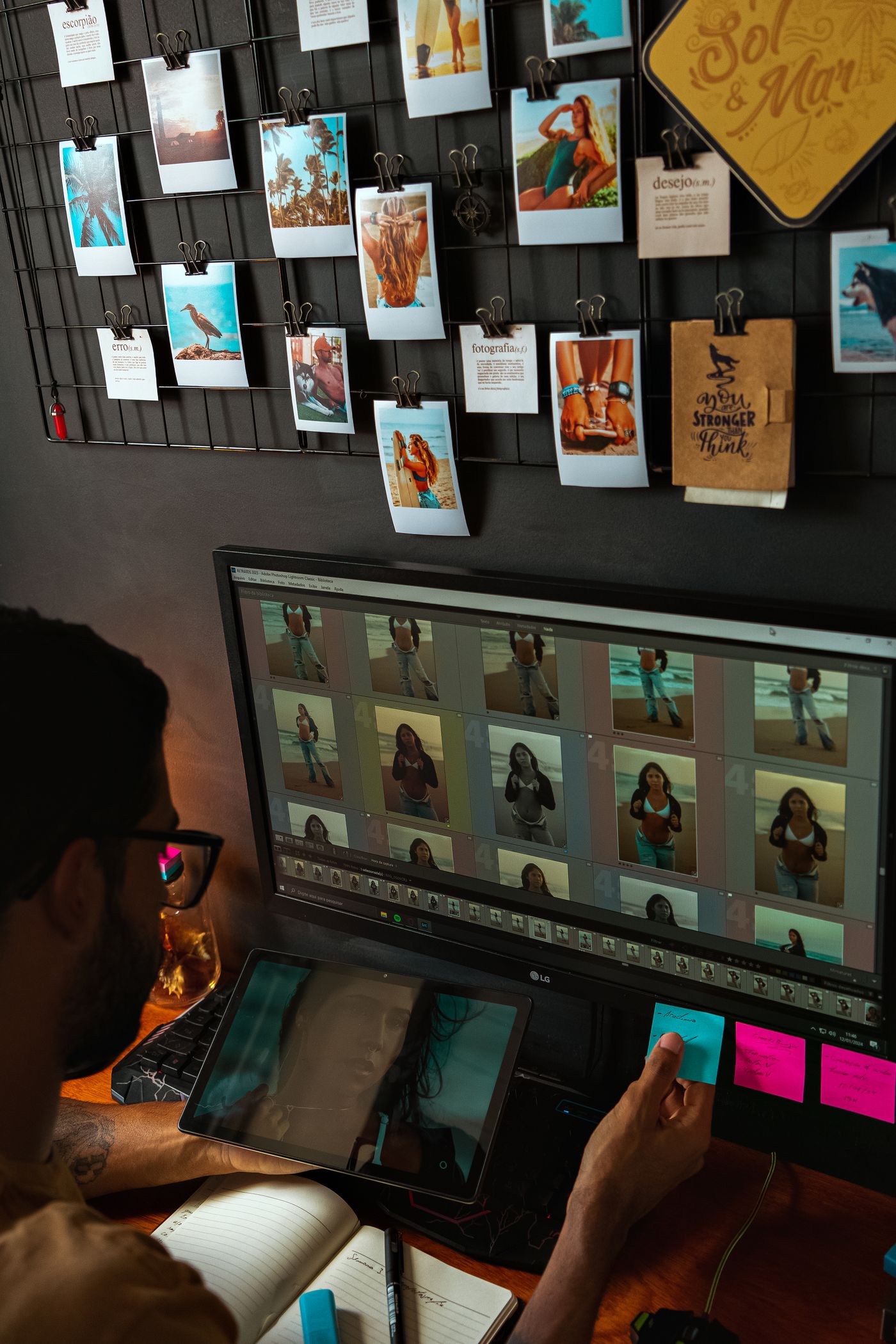 A reviewer checking a grid of finished product cutouts on a monitor for clean edges and consistent framing