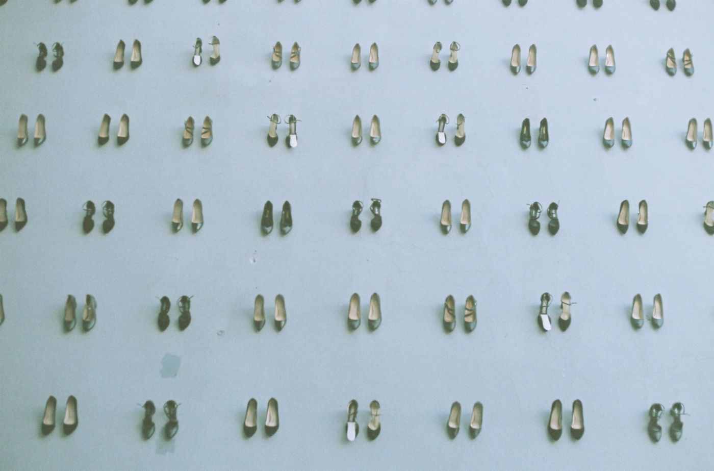 Nine sneaker listing photos arranged in a grid, each shoe cut out and placed on the same light gray background