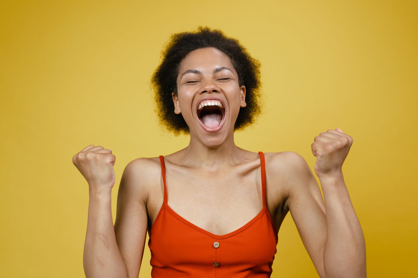 Expressive creator cutout with crisp hair edges placed on a bright yellow background