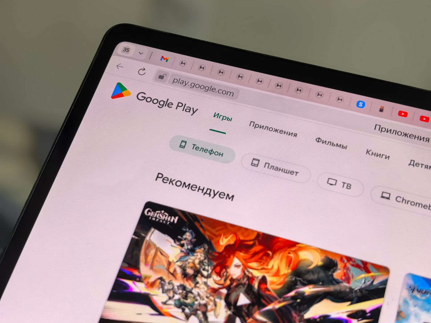 Close-up of a tablet screen displaying the Google Play Store app listing interface with app icons and install buttons